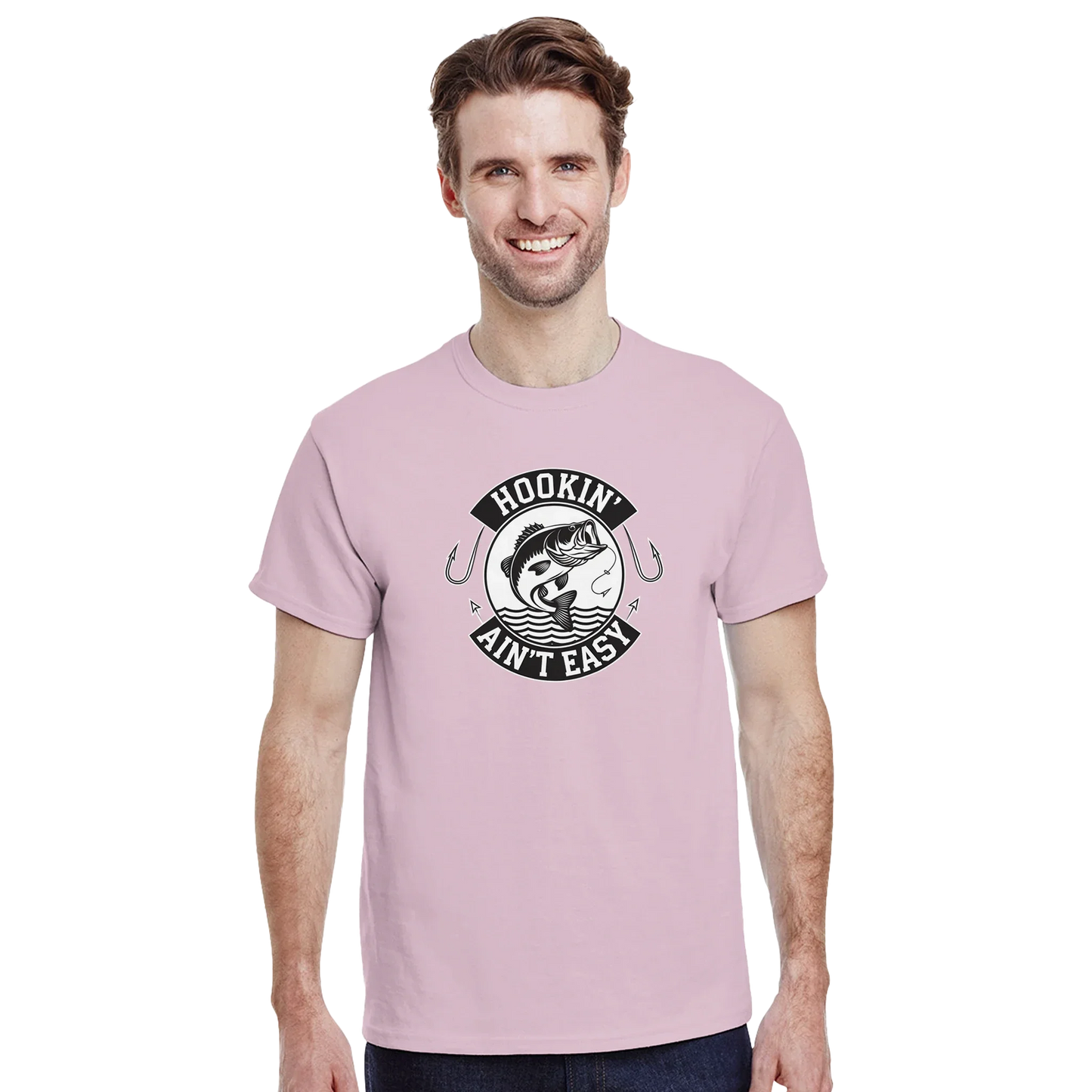 Man wearing a pink Hookin' Ain't Easy T-Shirt with fishing graphic and text on front