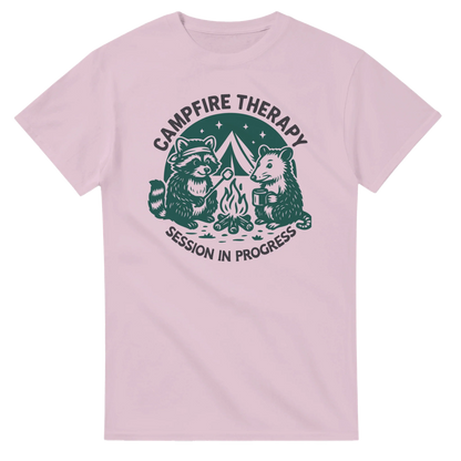 Pink Cute Campfire Therapy T-shirt with happy raccoon and bear campers illustration and "Session in Progress" text