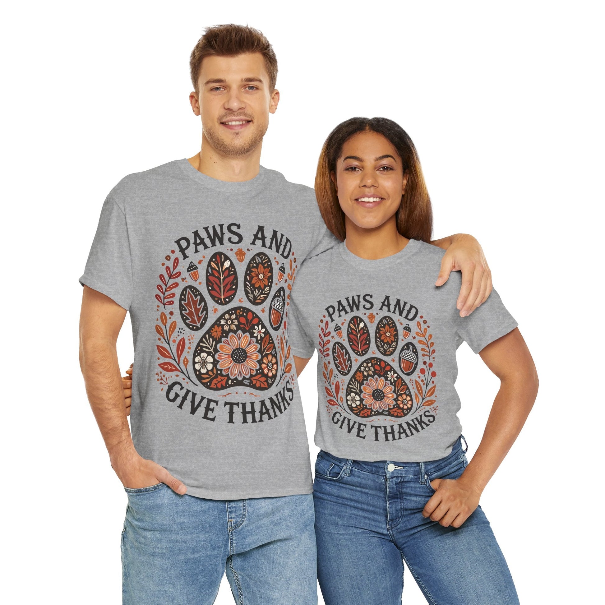 Unisex grey t-shirts with autumn floral paw print and "Paws and Give Thanks" text, cozy heavyweight fabric for fall.