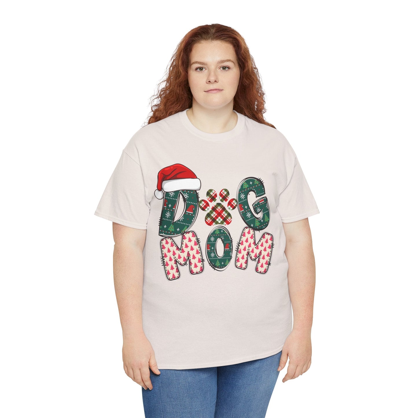 Plus size woman wearing a white Christmas Dog Mom Tee with festive holiday letters and Santa hat design