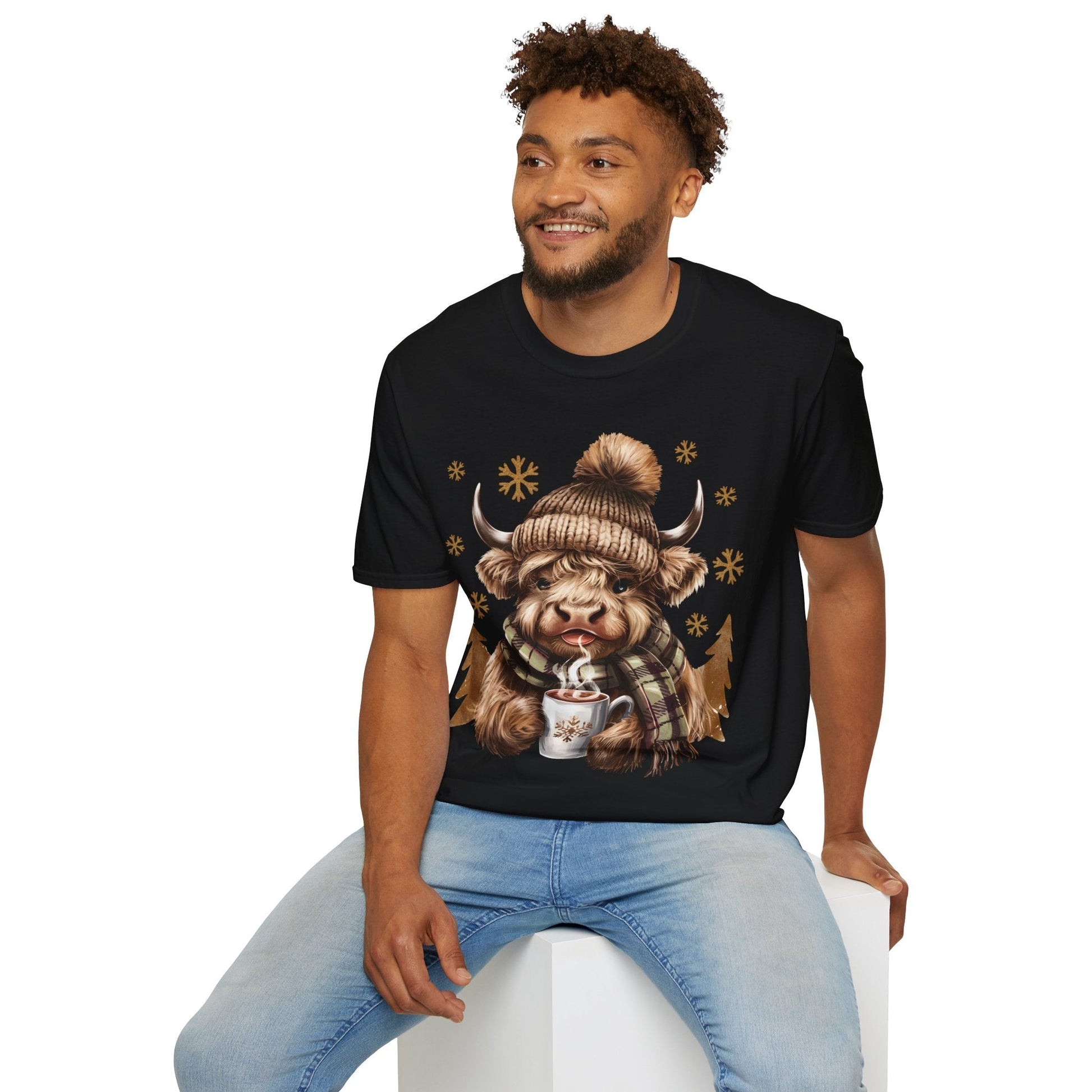 Man wearing black Highland Cow winter t-shirt with cozy hat and hot chocolate design
