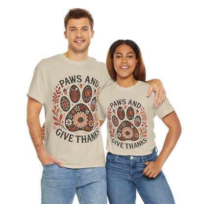 Couple wearing Paws and Give Thanks autumn-themed paw print t-shirts with fall foliage and acorns design
