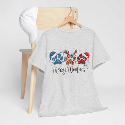 Merry Woofmas Christmas tee with festive paw prints in buffalo plaid, leopard spots, Santa hats, and antlers on gray unisex heavyweight cotton shirt