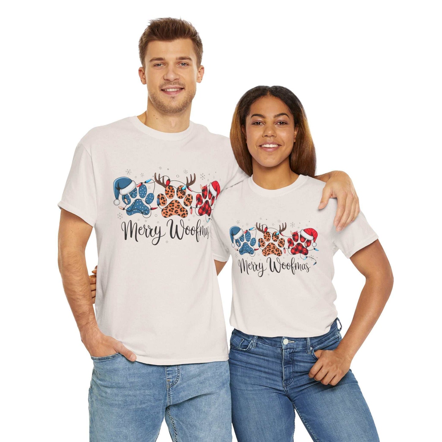 Couple wearing white "Merry Woofmas" Christmas tees with festive paw print designs in buffalo plaid, leopard spots, and holiday decorations