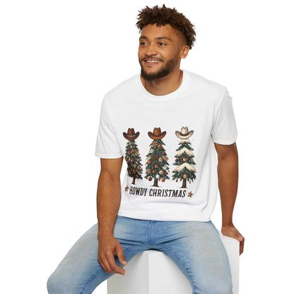 Man wearing white Howdy Christmas Cowboy Tree T-Shirt with three decorated Christmas trees topped with cowboy hats and text "Howdy Christmas"