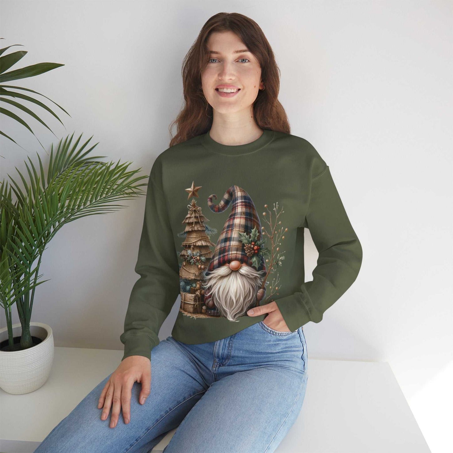 Woman wearing rustic plaid Christmas gnome sweatshirt with festive gnome, plaid hat, and rustic tree design