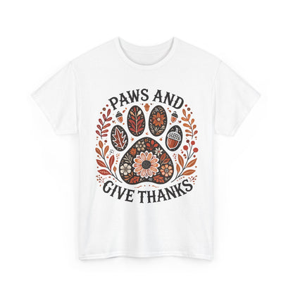 White t-shirt with autumn-themed paw print and "Paws and Give Thanks" text design