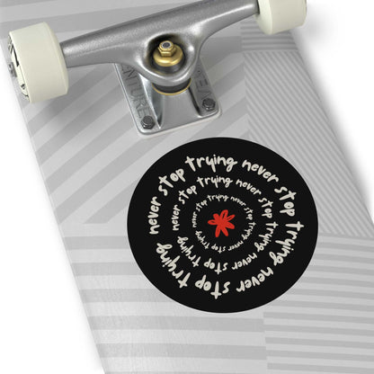 Don't Stop Trying motivational round vinyl sticker on skateboard deck