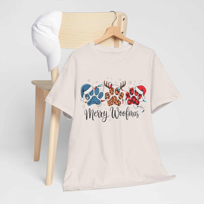 Merry Woofmas Christmas tee with festive paw prints in buffalo plaid, leopard spots, and holiday hats on unisex heavyweight cotton shirt