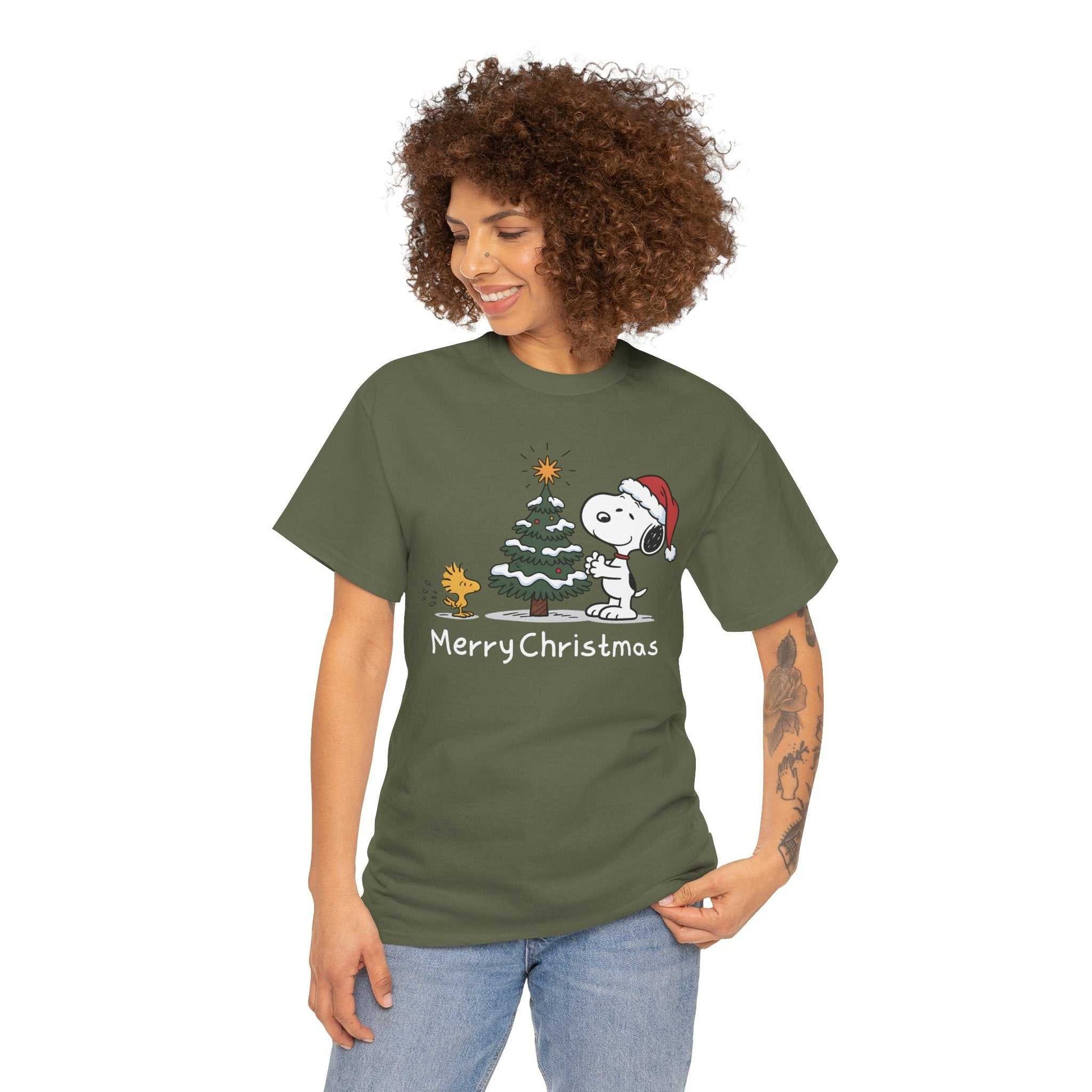 Woman wearing green Snoopy and Woodstock Merry Christmas t-shirt with festive holiday graphic