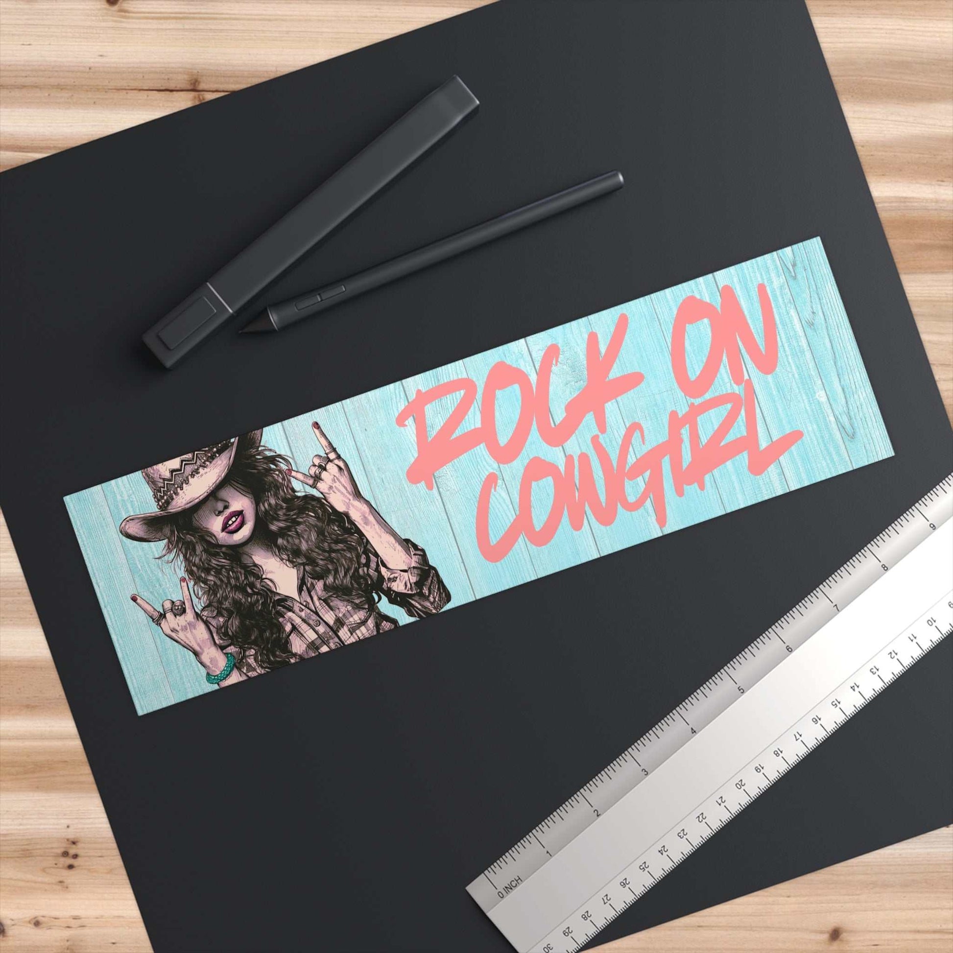 Rock On Vintage Cowgirl bumper sticker with sassy cowgirl graphic and vibrant text on wooden background