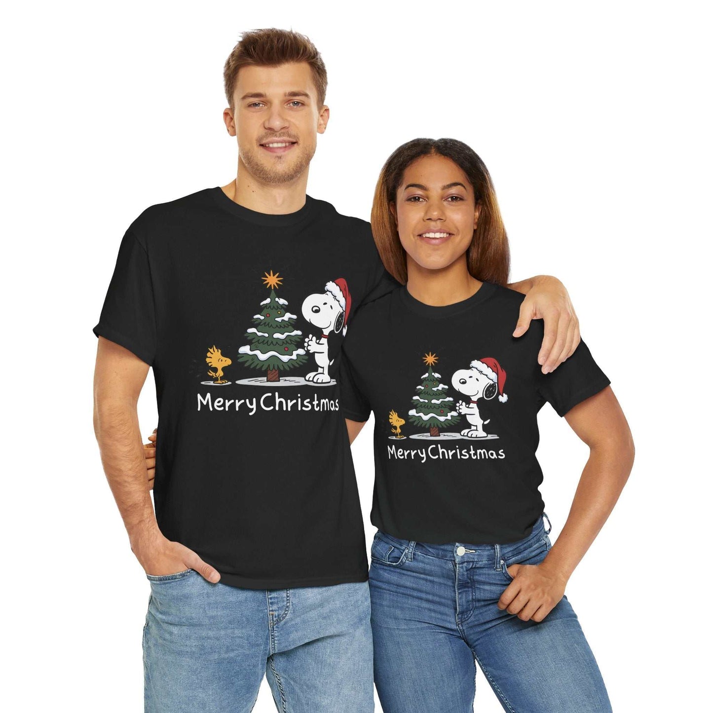 Couple wearing black Snoopy & Woodstock Merry Christmas T-shirts with holiday tree design