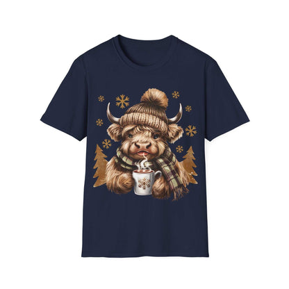 Navy t-shirt featuring a cozy Highland Cow wearing a knit hat and plaid scarf holding a steaming hot chocolate mug with snowflakes.
