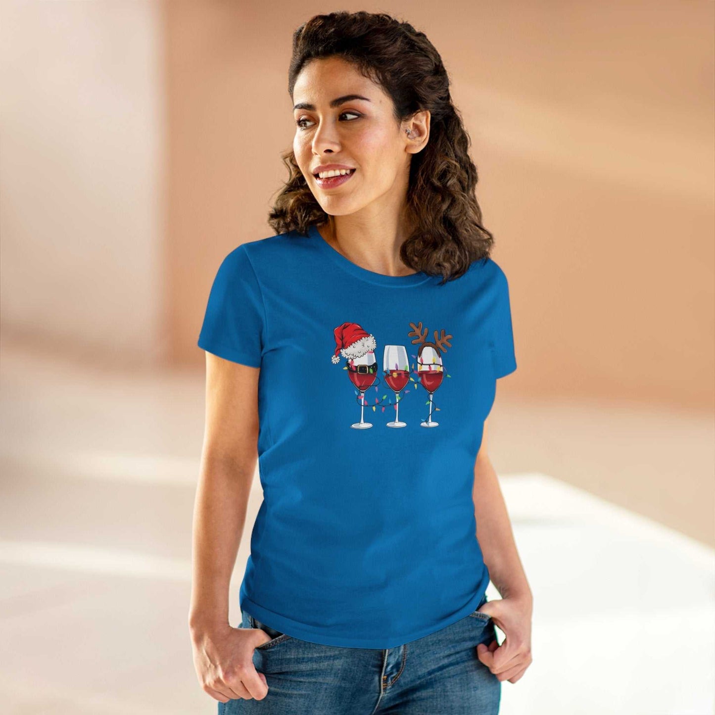 Woman wearing blue Wine Glasses Christmas T-Shirt with festive wine glass design featuring Santa hat and reindeer antlers