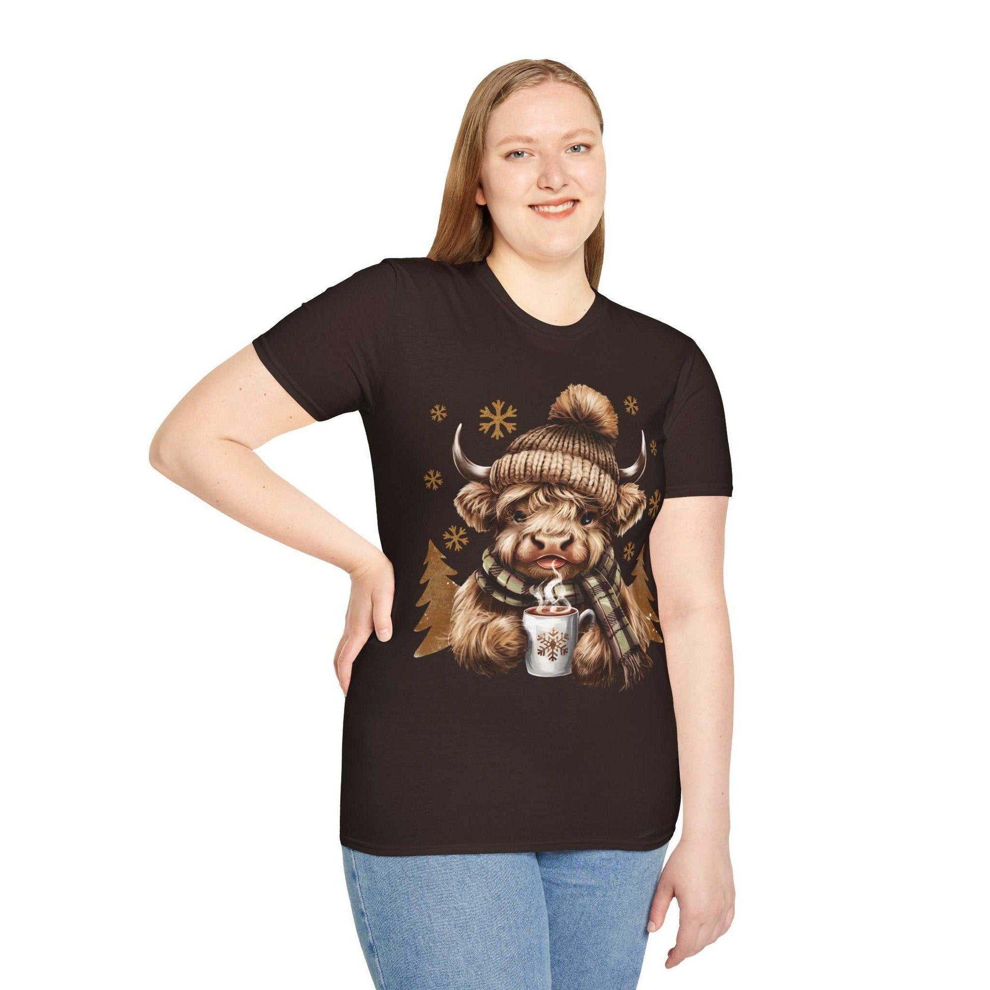 Woman wearing black Highland Cow t-shirt with winter hat and hot chocolate design