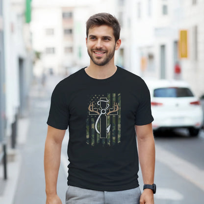 Man wearing a black Patriotic Hunting Fishing Faith T-Shirt with deer antlers and cross design on front in urban setting