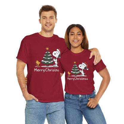Couple wearing red Snoopy & Woodstock Merry Christmas T-shirts with holiday graphic of Snoopy in Santa hat and Christmas tree