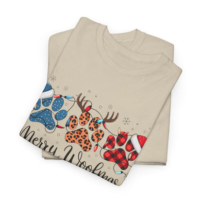 Merry Woofmas Christmas tee with festive paw prints, buffalo plaid, leopard spots, Santa hats, and holiday lights on beige unisex heavyweight cotton shirt