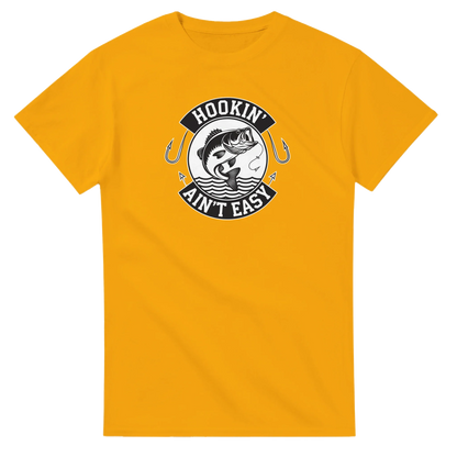 Hookin' Ain't Easy T-Shirt in yellow with fishing graphic and humorous text design