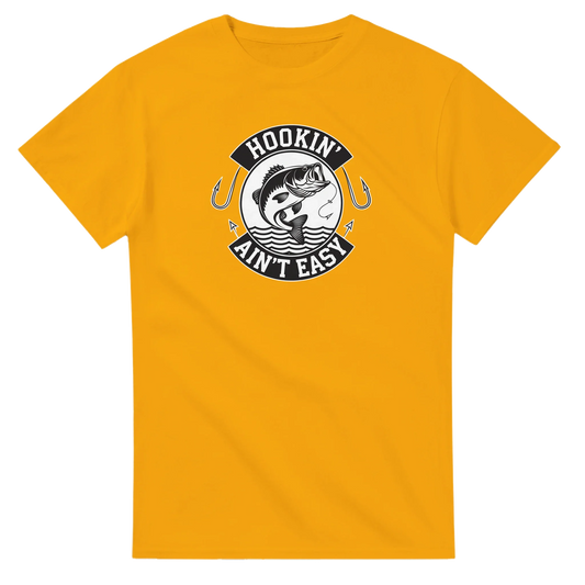 Hookin' Ain't Easy T-Shirt in yellow with fishing graphic and humorous text design