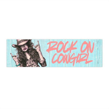 Rock On Vintage Cowgirl bumper sticker with sassy cowgirl showing rock-and-roll horns and bold pink text on blue wood background