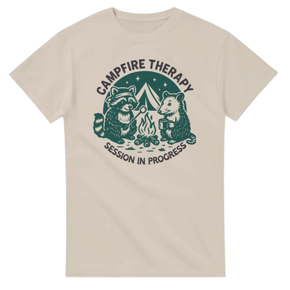 Cute Campfire Therapy T-shirt with happy critter campers around a campfire design on a beige cotton tee