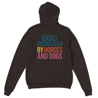 Black hoodie with colorful "Easily Distracted by Horses and Dogs" text on back, cozy cotton-poly blend, front pouch pocket.