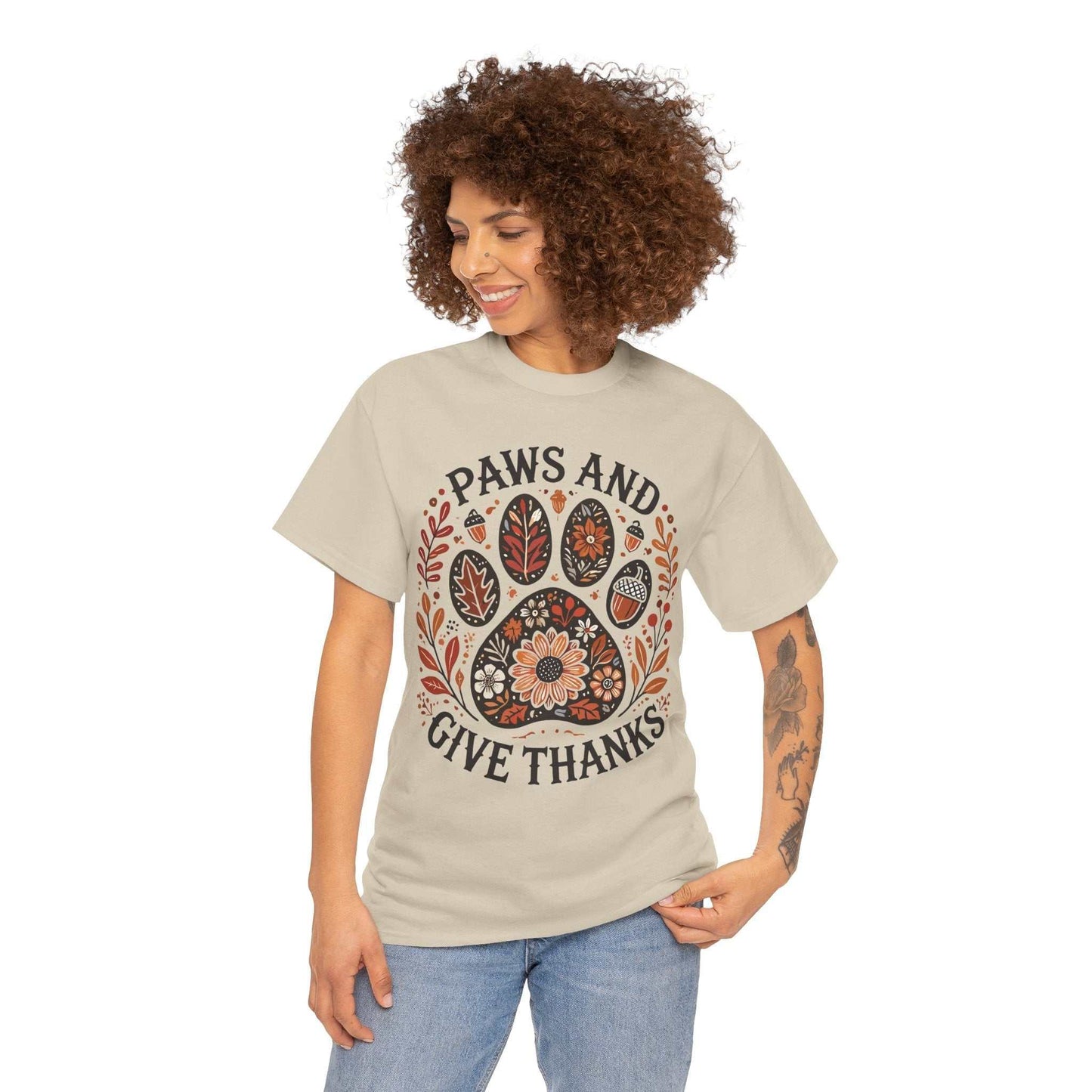 woman wearing beige Paws and Give Thanks t-shirt with autumn paw print design