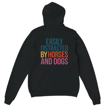 Black hoodie with "Easily Distracted by Horses and Dogs" colorful text on the back, soft cotton-polyester blend, cozy hood, and front pocket