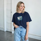 Woman wearing navy WTF Where's The Fish whimsical fishing t-shirt with classic cotton fit and graphic design