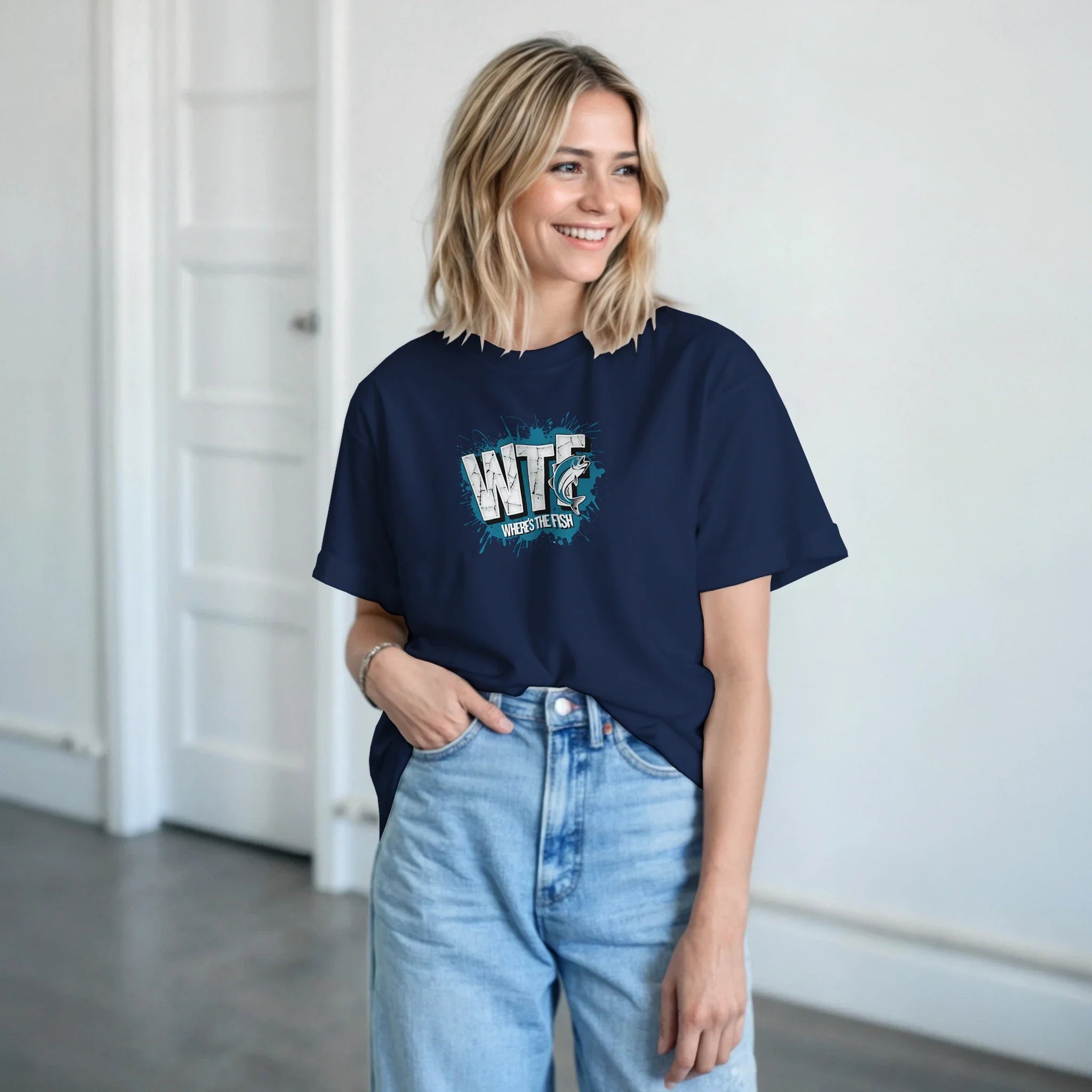 Woman wearing navy WTF Where's The Fish whimsical fishing t-shirt with classic cotton fit and graphic design