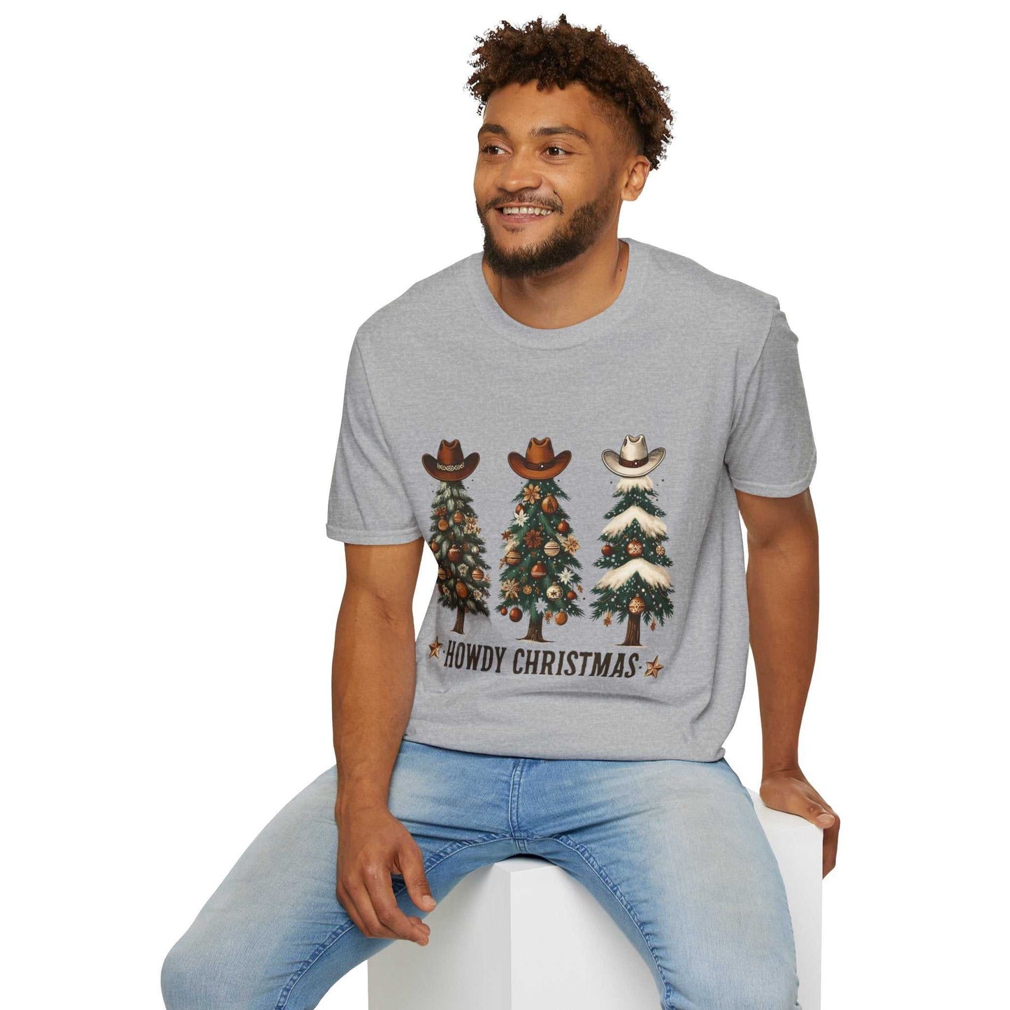 Man wearing sport grey Howdy Christmas Cowboy Tree T-Shirt with three decorated Christmas trees topped with cowboy hats graphic