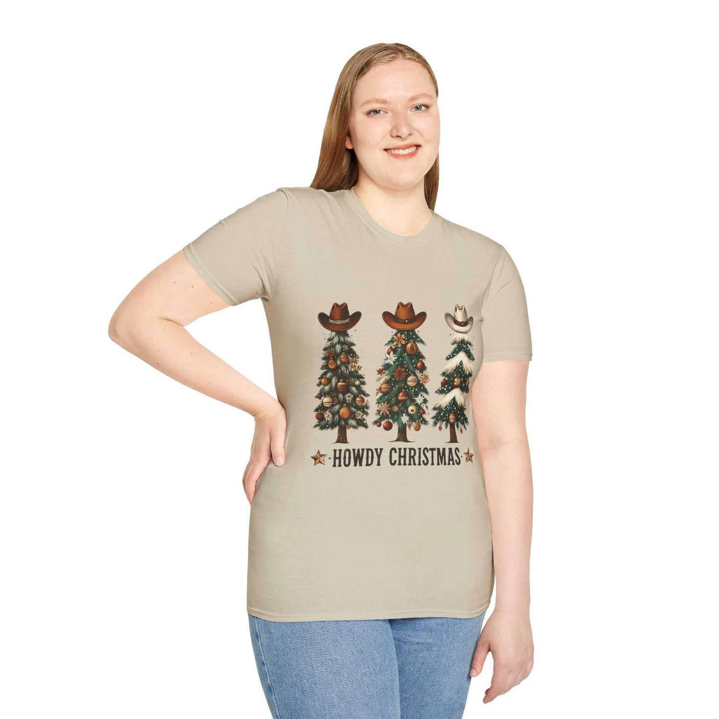 Howdy Christmas Cowboy Tree T-shirt with three decorated Christmas trees wearing cowboy hats on a beige unisex tee