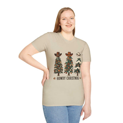 Howdy Christmas Cowboy Tree T-shirt with three decorated Christmas trees wearing cowboy hats on a beige unisex tee