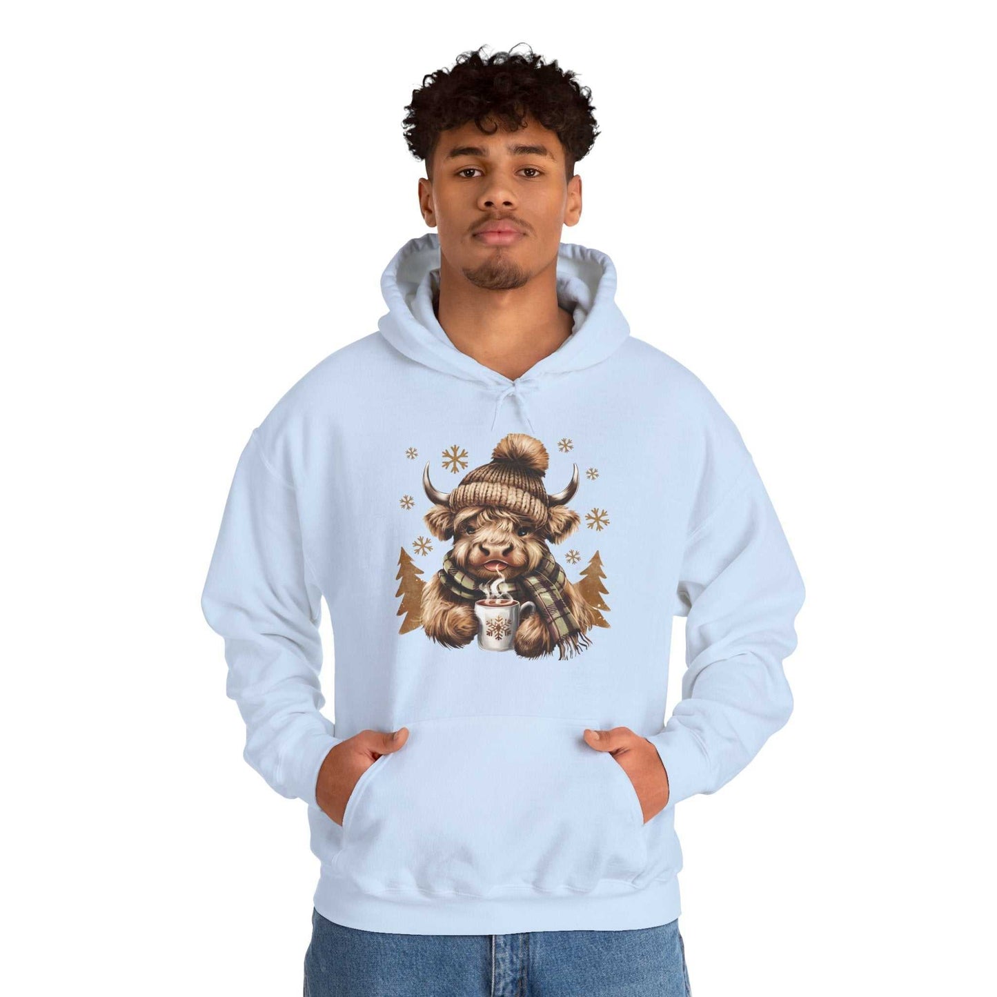 Light blue Highland Cow Hoodie with cozy winter cow design and hot chocolate mug