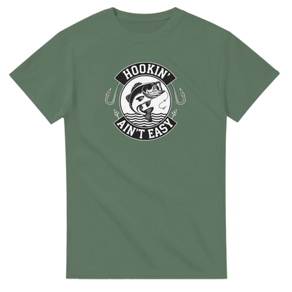 Hookin' Ain't Easy T-Shirt with fishing graphic on green heavyweight cotton fabric