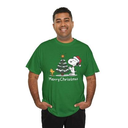 Man wearing green Snoopy & Woodstock Merry Christmas holiday t-shirt with Snoopy in Santa hat beside Christmas tree and Woodstock.