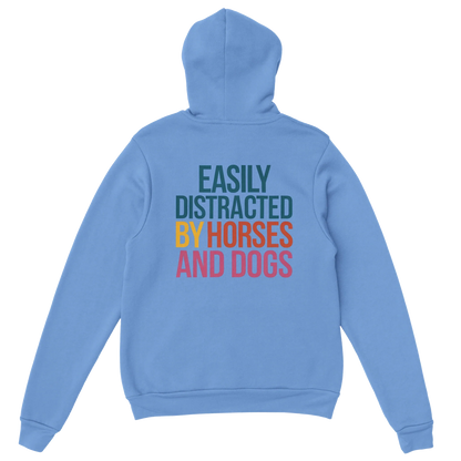 Light blue easily distracted hoodie with colorful text by horses and dogs on back