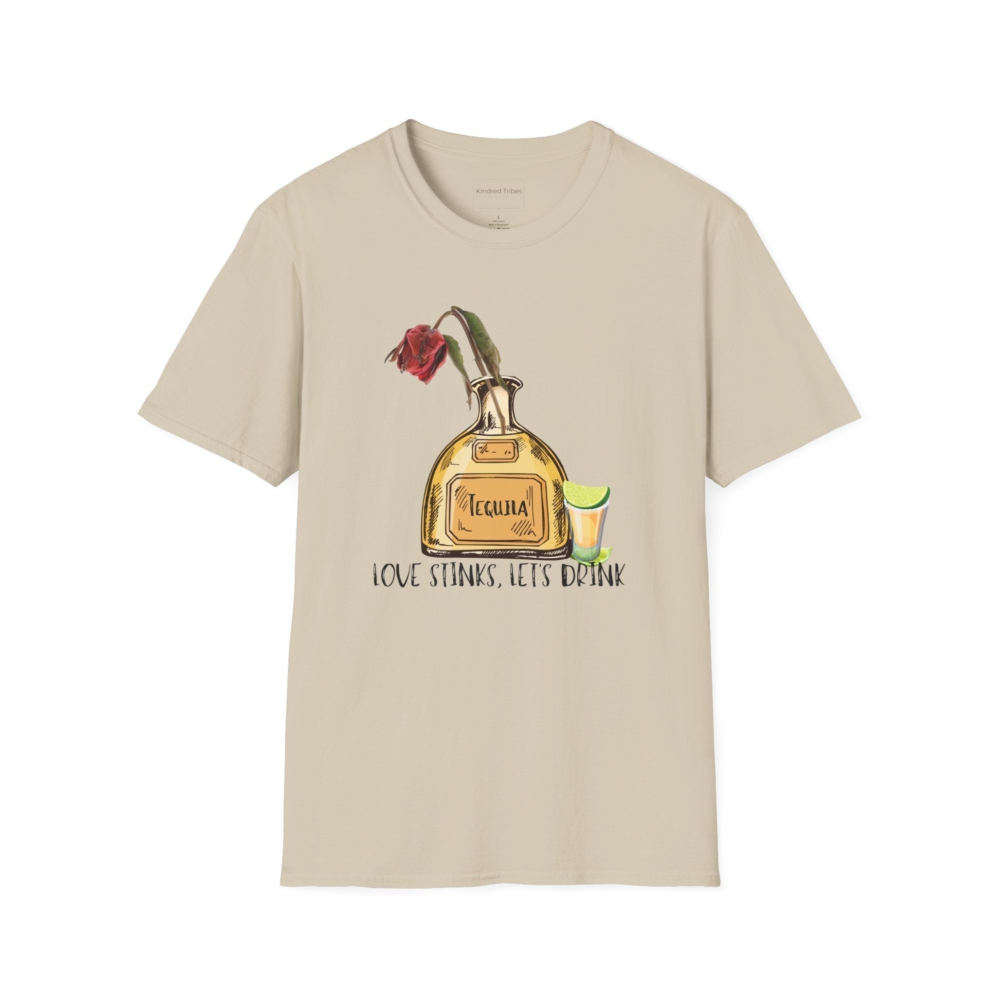 Beige Love Stinks Let’s Drink Anti-V Day Tee with a graphic Tequila bottle with a wilted rose in it, a shot glass with limes to the side, and text of Love Stinks, Let's Drink under it. 