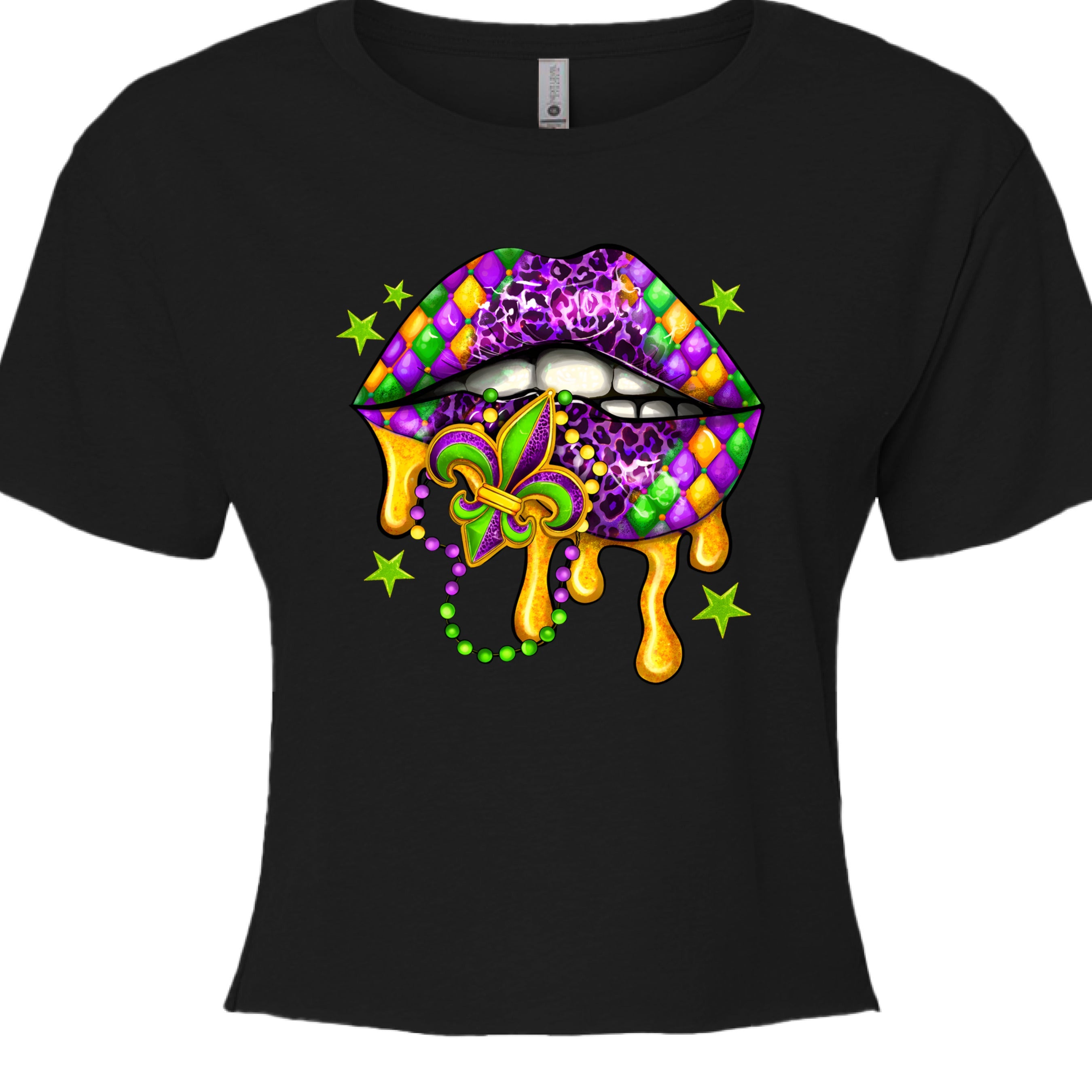 A black, cropped Mardi Gras Lips Baby Tee featuring a large, vibrant graphic of a pair of lips decorated in Mardi Gras themes. The top lip features a purple, gold, and green diamond harlequin pattern, while the bottom lip has a purple leopard print. Gold liquid "drips" from the mouth, which holds a decorative Fleur-de-lis and a string of Mardi Gras beads. 