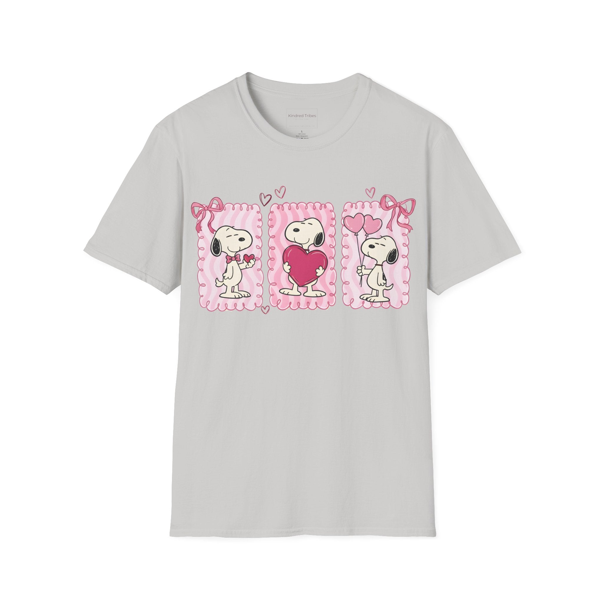 Light Grey T-shirt with three distinct panels of Snoopy—sharing a small heart, hugging a giant one, and holding heart-shaped balloons—this tee is a playful celebration of friendship, affection, and the "Puppy Love" spirit.