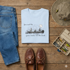 The Best Friends Fishin' In The Dark T-Shirt shows two women in a fishing boat fishing with the moon shining down in a black and white hand sketched print design on a light blue cotton tee.