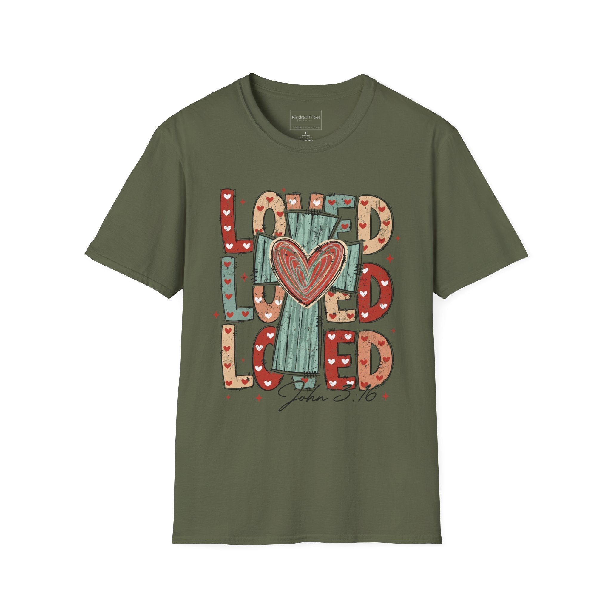 Green Loved Cross Heart T-Shirt featuring a large, colorful graphic on the front. The design consists of the word "LOVED" repeated three times in a stacked, chunky block font. The letters are filled with various patterns, including solid colors, stripes, and small hearts in shades of red, sage green, and tan. In the center of the text is a distressed, teal-colored cross with a large, hand-drawn red heart layered over the middle. Below the main graphic, the scripture reference "John 3:16" is written.