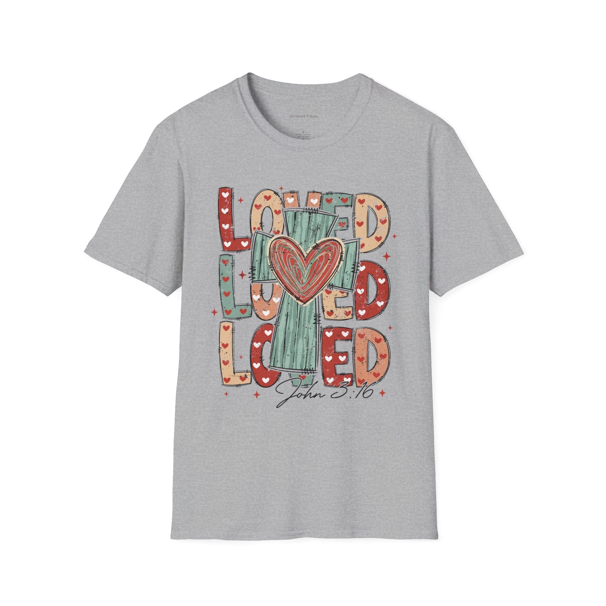 Sport Grey Loved Cross Heart T-Shirt featuring a large, colorful graphic on the front. The design consists of the word "LOVED" repeated three times in a stacked, chunky block font. The letters are filled with various patterns, including solid colors, stripes, and small hearts in shades of red, sage green, and tan. In the center of the text is a distressed, teal-colored cross with a large, hand-drawn red heart layered over the middle. Below the main graphic, the scripture reference "John 3:16" is written.