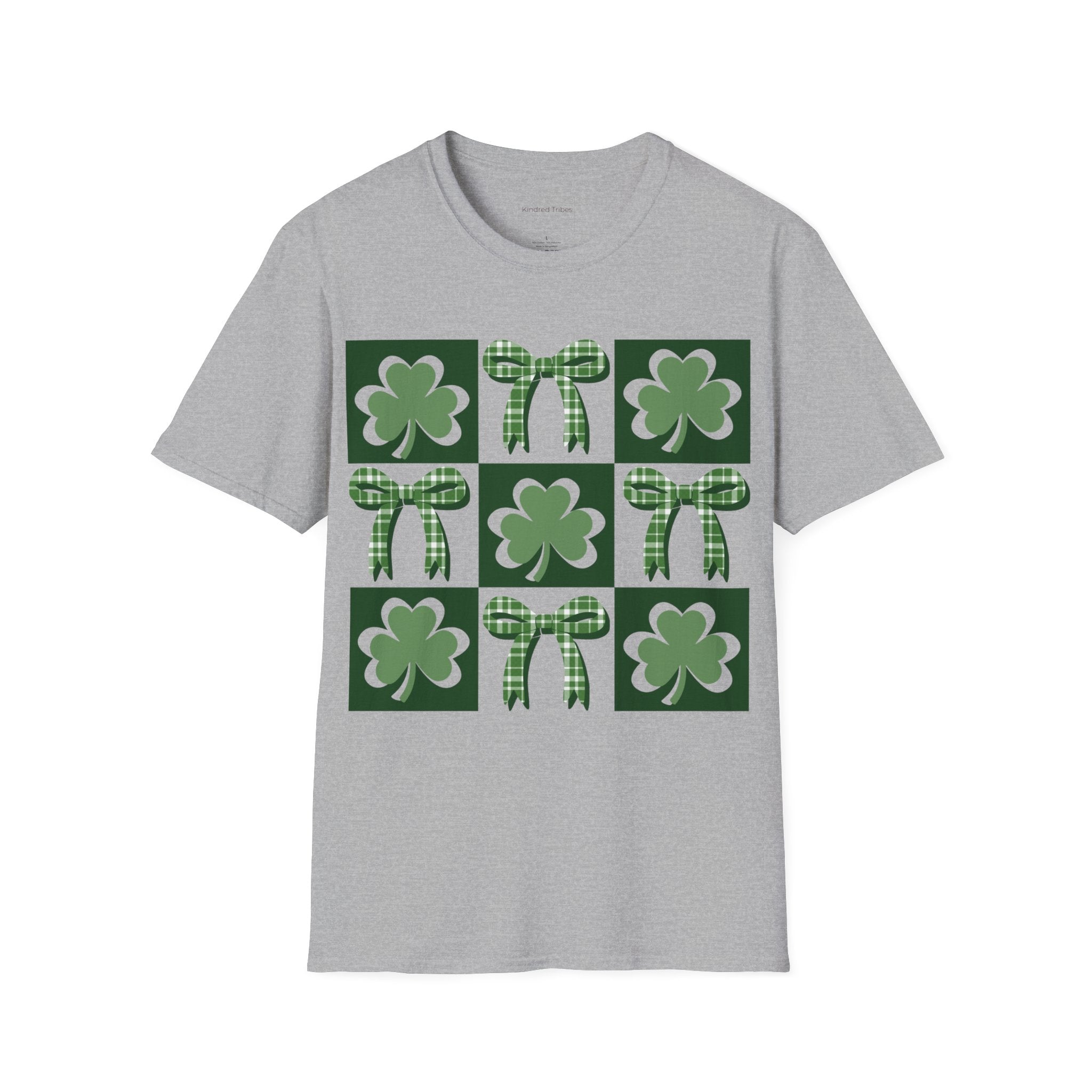A Sport Grey Lucky Coquette t-shirt featuring a 3x3 square grid graphic. The grid alternates between squares with a solid dark green background containing a lighter green shamrock and squares containing a green-and-white checkered bow. The design is modern, symmetrical, and preppy in style