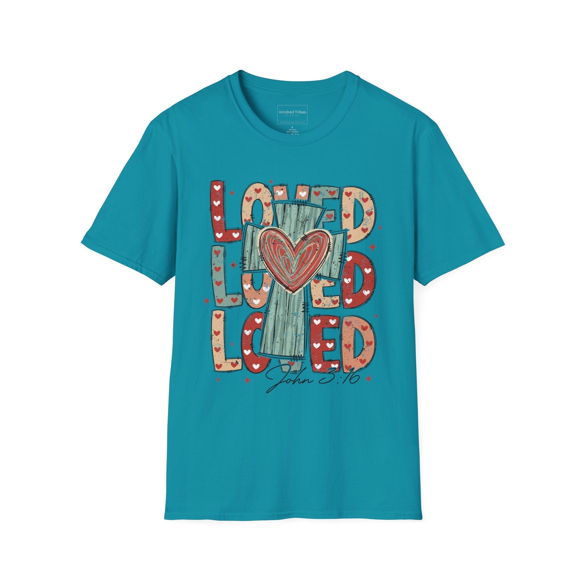 Tropical Blue Loved Cross Heart T-Shirt featuring a large, colorful graphic on the front. The design consists of the word "LOVED" repeated three times in a stacked, chunky block font. The letters are filled with various patterns, including solid colors, stripes, and small hearts in shades of red, sage green, and tan. In the center of the text is a distressed, teal-colored cross with a large, hand-drawn red heart layered over the middle. Below the main graphic, the scripture reference "John 3:16" is written.