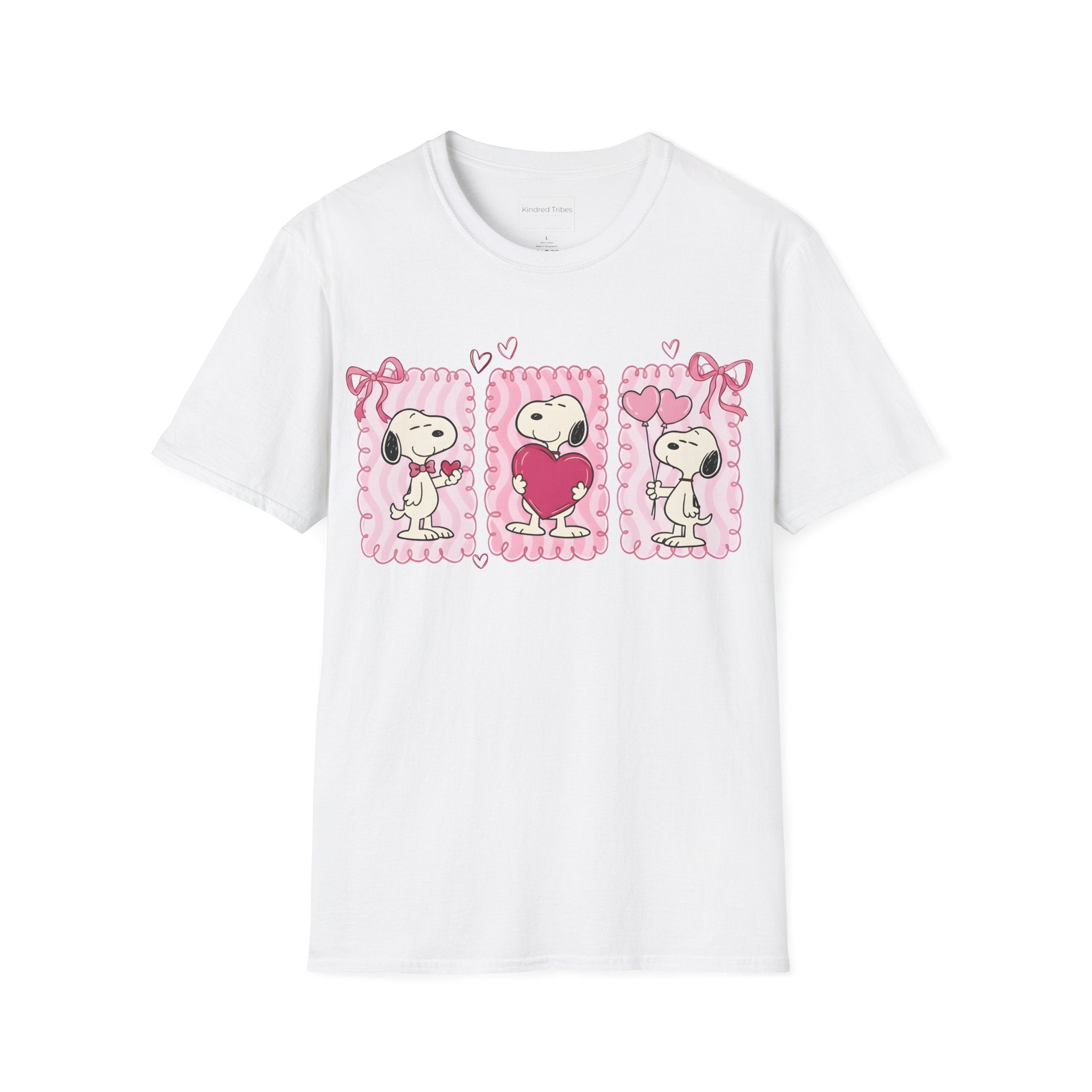 White T-shirt with three distinct panels of Snoopy—sharing a small heart, hugging a giant one, and holding heart-shaped balloons—this tee is a playful celebration of friendship, affection, and the "Puppy Love" spirit.