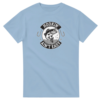 Light blue Hookin' Ain't Easy T-Shirt with fishing graphic and text, heavyweight cotton, durable double-needle seams