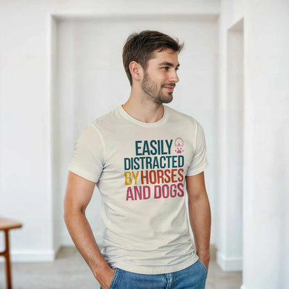 Man wearing Easily Distracted By Horses and Dogs T-Shirt with colorful text and animal prints