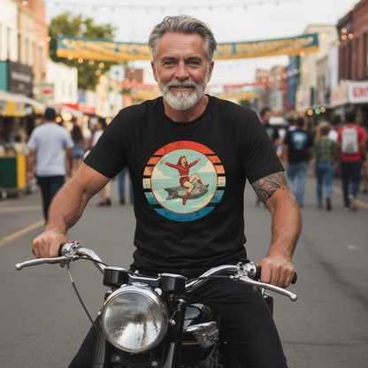 Man wearing black Devastator T-Shirt with vintage WWII bomber nose art pin-up girl design on motorcycle in street setting